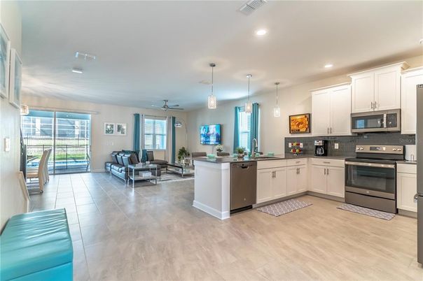 Dining room, Interior, Kitchen, Living room, Pendant Lights, Recessed Lighting, Stainless Steel Appliances, Wood Texture Flooring