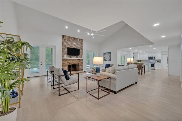 Fireplace, Interior, Kitchen, Living room, Recessed Lighting, Stainless Steel Appliances, Stone Walls