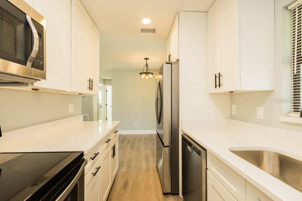 Interior, Kitchen, Pendant Lights, Recessed Lighting, Stainless Steel Appliances, Wood Texture Flooring