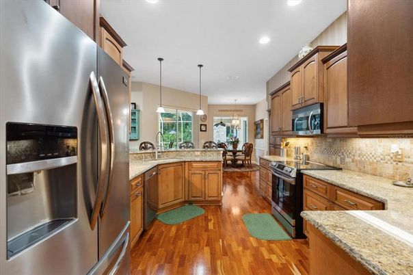 Dining room, Interior, Kitchen, Pendant Lights, Recessed Lighting, Stainless Steel Appliances, Wood Texture Flooring