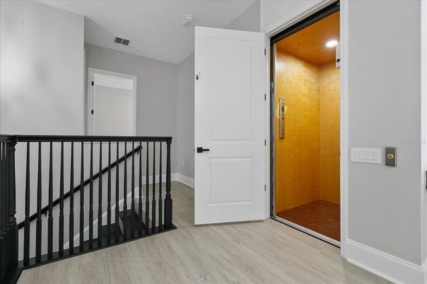 Elevator, Interior, Recessed Lighting, Wood Texture Flooring, Wooden Walls