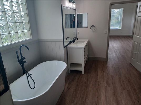 Bathroom, Dual Sink Vanities, Free Standing Baths, Interior, Wood Texture Flooring