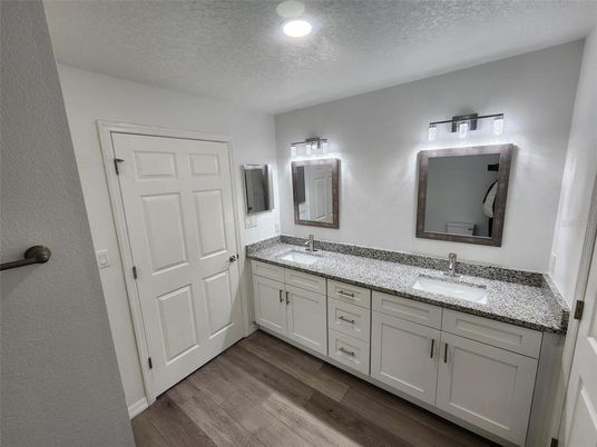 Bathroom, Dual Sink Vanities, Interior, Recessed Lighting, Wood Texture Flooring