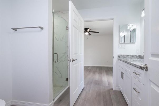 Bathroom, Glass Shower, Interior, Marble Walls, Wood Texture Flooring