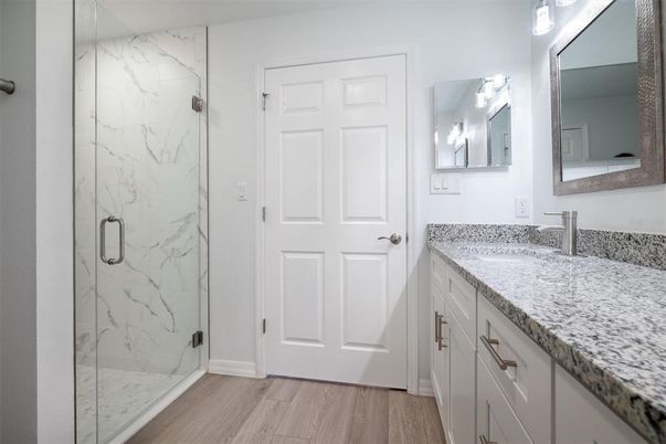 Bathroom, Glass Shower, Interior, Marble Walls, Wood Texture Flooring