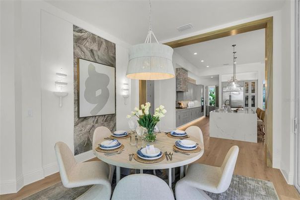 Dining room, Fireplace, Interior, Kitchen, Pendant Lights, Recessed Lighting, Stainless Steel Appliances, Wood Texture Flooring