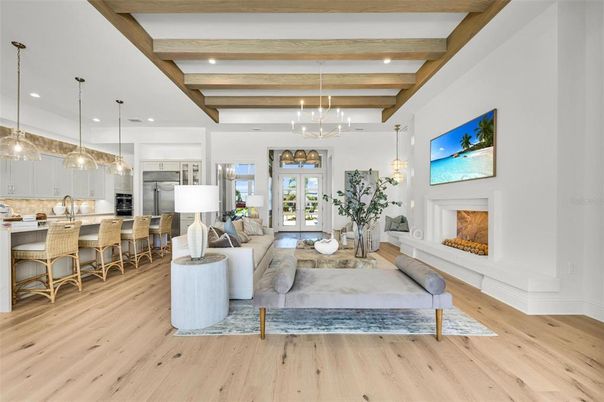 Fireplace, Interior, Kitchen, Living room, Pendant Lights, Recessed Lighting, Stainless Steel Appliances, Wooden Beams, Wood Texture Flooring