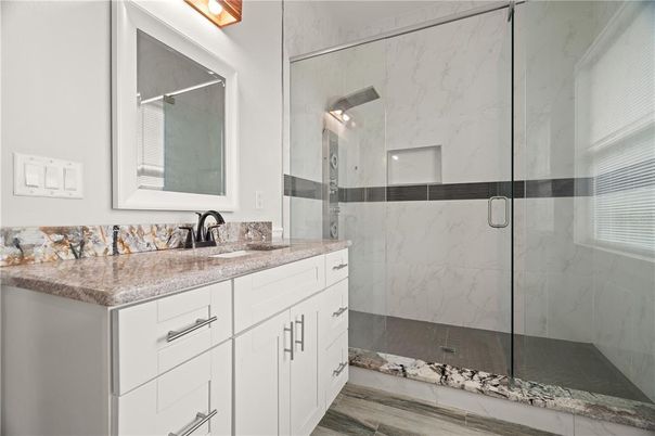 Bathroom, Glass Shower, Interior, Marble Walls, Wood Texture Flooring
