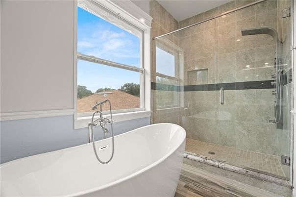 Bathroom, Free Standing Baths, Glass Shower, Interior, Recessed Lighting, Wood Texture Flooring