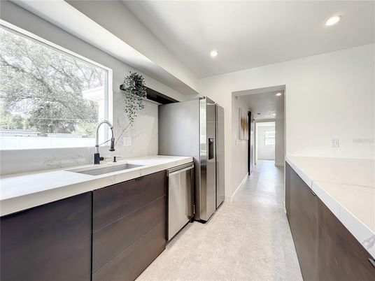 Interior, Kitchen, Marble Walls, Recessed Lighting, Stainless Steel Appliances