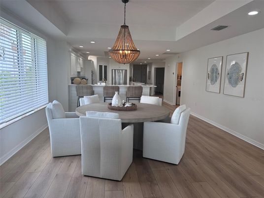 Chandelier, Dining room, Interior, Kitchen, Pendant Lights, Recessed Lighting, Stainless Steel Appliances, Wood Texture Flooring