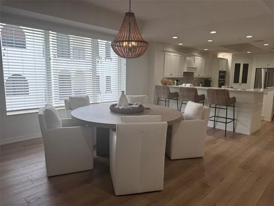 Dining room, Interior, Kitchen, Pendant Lights, Recessed Lighting, Stainless Steel Appliances, Wood Texture Flooring