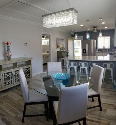 Chandelier, Dining room, Interior, Kitchen, Pendant Lights, Recessed Lighting, Stainless Steel Appliances, Wood Texture Flooring