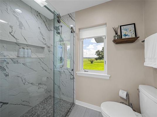 Bathroom, Glass Shower, Interior, Marble Walls, Wood Texture Flooring