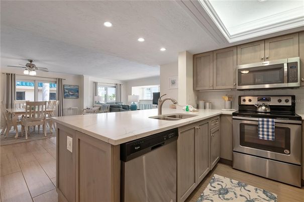 Dining room, Interior, Kitchen, Recessed Lighting, Stainless Steel Appliances, Wood Texture Flooring