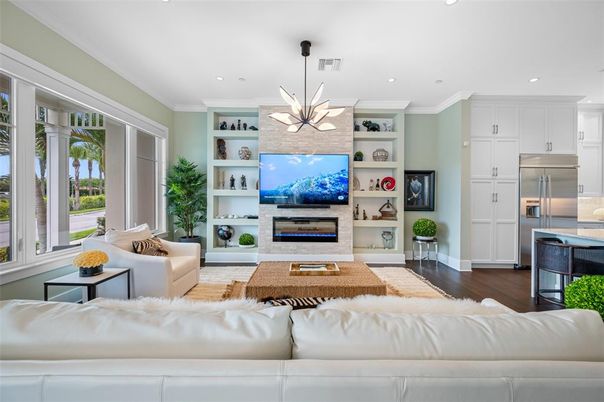 Fireplace, Interior, Kitchen, Living room, Pendant Lights, Recessed Lighting, Stainless Steel Appliances, Wood Texture Flooring