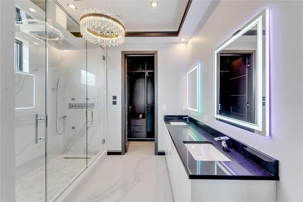 Bathroom, Chandelier, Dual Sink Vanities, Glass Shower, Interior, Marble, Marble Walls, Recessed Lighting