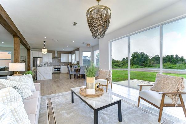 Chandelier, Dining room, Interior, Kitchen, Living room, Pendant Lights, Recessed Lighting, Stainless Steel Appliances, Wood Texture Flooring