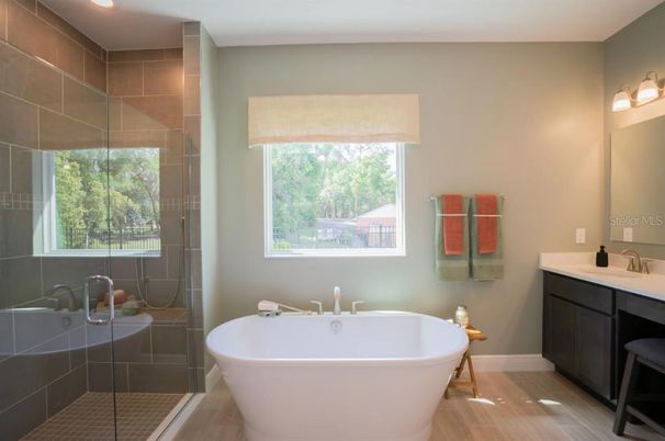 Bathroom, Free Standing Baths, Glass Shower, Interior, Recessed Lighting, Wood Texture Flooring