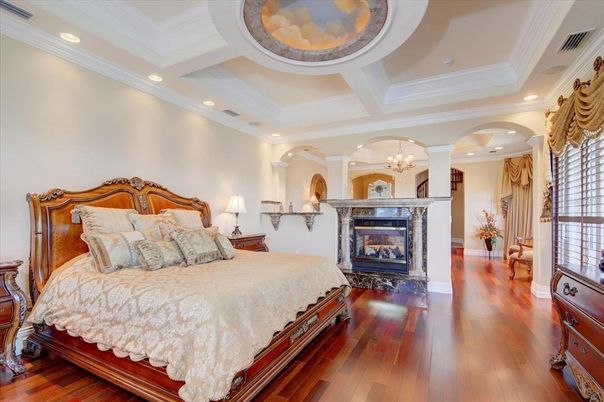 Bedroom, Chandelier, Fireplace, Interior, Recessed Lighting, Wood Texture Flooring