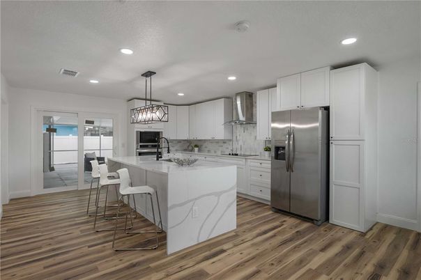 Interior, Kitchen, Pendant Lights, Recessed Lighting, Stainless Steel Appliances, Wood Texture Flooring