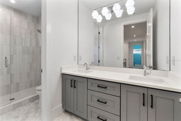 Bathroom, Dual Sink Vanities, Glass Shower, Interior, Marble, Recessed Lighting