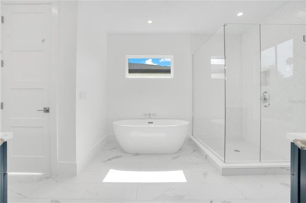 Bathroom, Free Standing Baths, Glass Shower, Interior, Marble, Marble Walls, Recessed Lighting