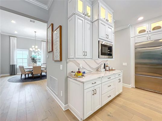 Chandelier, Dining room, Interior, Kitchen, Pendant Lights, Recessed Lighting, Stainless Steel Appliances, Wood Texture Flooring