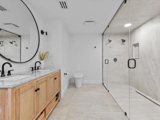 Bathroom, Dual Sink Vanities, Glass Shower, Interior, Marble Walls, Recessed Lighting