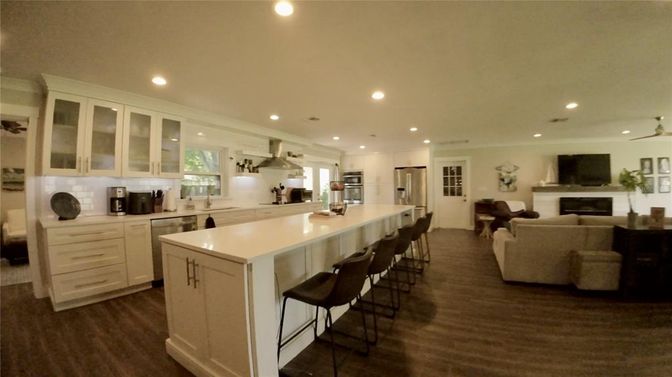 Fireplace, Interior, Kitchen, Living room, Recessed Lighting, Stainless Steel Appliances, Wood Texture Flooring