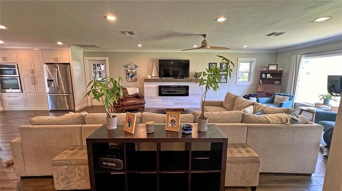 Fireplace, Interior, Kitchen, Living room, Recessed Lighting, Stainless Steel Appliances, Wood Texture Flooring