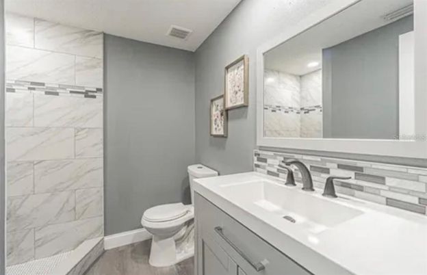 Bathroom, Glass Shower, Interior, Marble Walls, Recessed Lighting, Wood Texture Flooring