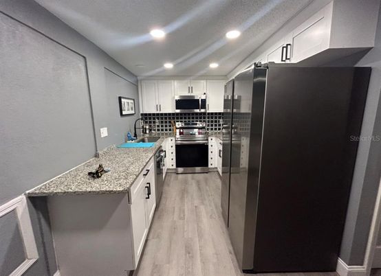 Interior, Kitchen, Recessed Lighting, Stainless Steel Appliances, Wood Texture Flooring