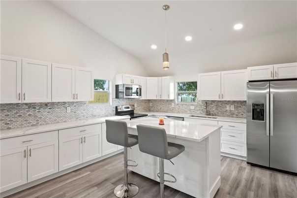Interior, Kitchen, Pendant Lights, Recessed Lighting, Stainless Steel Appliances, Wood Texture Flooring