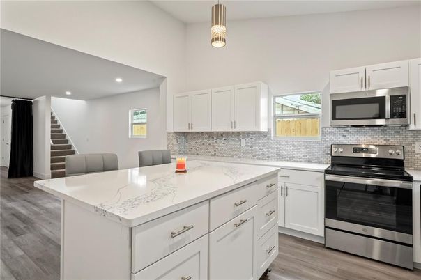 Interior, Kitchen, Pendant Lights, Recessed Lighting, Stainless Steel Appliances, Wood Texture Flooring