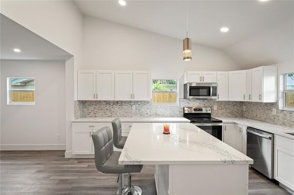 Interior, Kitchen, Pendant Lights, Recessed Lighting, Stainless Steel Appliances, Wood Texture Flooring