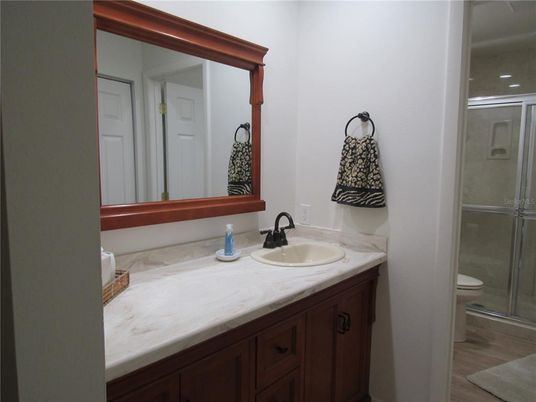 Bathroom, Dual Sink Vanities, Glass Shower, Interior, Wood Texture Flooring