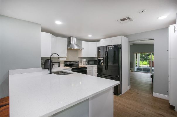 Interior, Kitchen, Recessed Lighting, Stainless Steel Appliances, Wood Texture Flooring