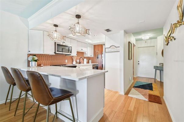 Chandelier, Interior, Kitchen, Pendant Lights, Recessed Lighting, Stainless Steel Appliances, Wood Texture Flooring