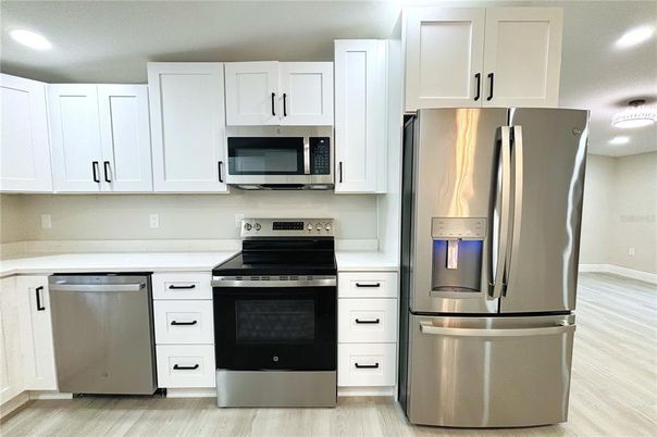 Interior, Kitchen, Recessed Lighting, Stainless Steel Appliances, Wood Texture Flooring