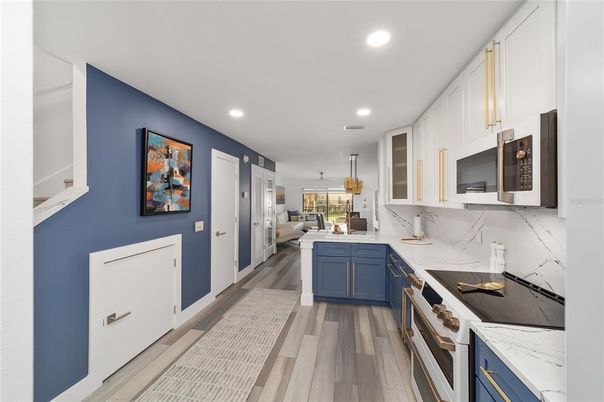 Interior, Kitchen, Marble Walls, Pendant Lights, Recessed Lighting, Wood Texture Flooring