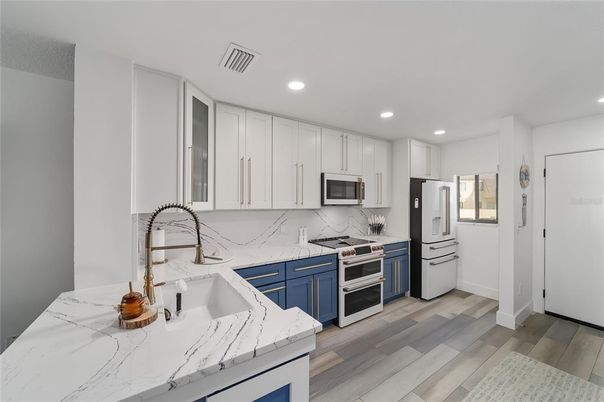 Interior, Kitchen, Recessed Lighting, Stainless Steel Appliances, Wood Texture Flooring