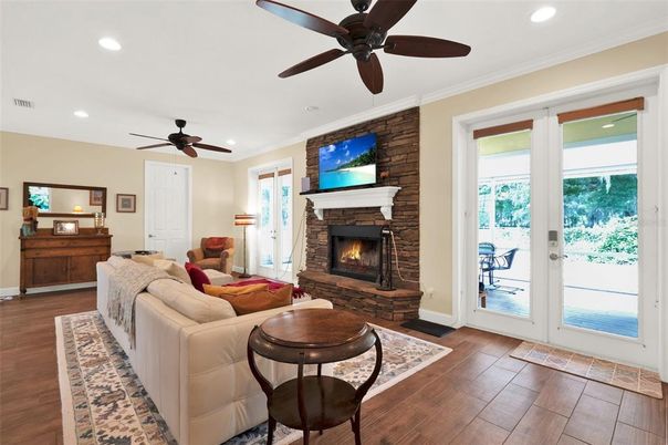 Fireplace, Interior, Living room, Recessed Lighting, Stone Walls, Wood Texture Flooring