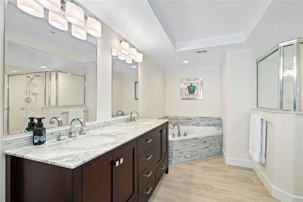 Bathroom, Dual Sink Vanities, Glass Shower, Interior, Recessed Lighting, Wood Texture Flooring