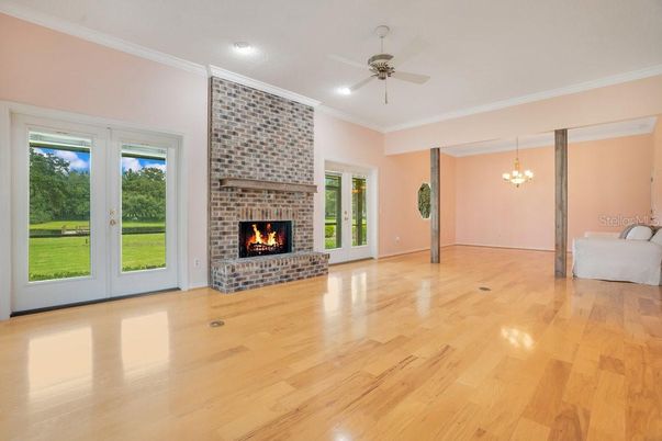 Chandelier, Empty room, Fireplace, Interior, Recessed Lighting, Wood Texture Flooring