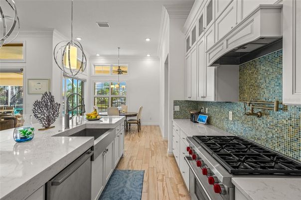 Dining room, Interior, Kitchen, Pendant Lights, Recessed Lighting, Stainless Steel Appliances, Wood Texture Flooring
