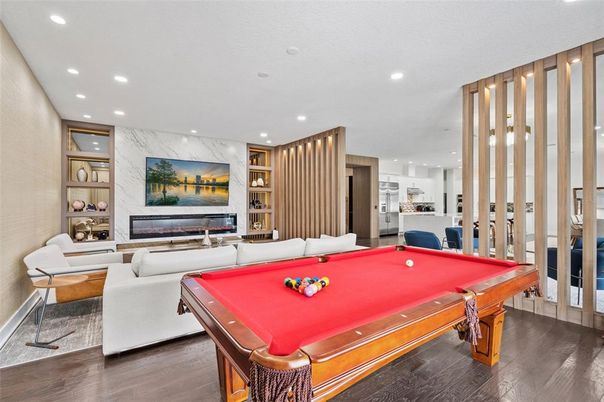 Billiard Table, Fireplace, Game Room, Interior, Living room, Recessed Lighting, Wood Texture Flooring