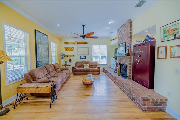 Fireplace, Interior, Living room, Recessed Lighting, Stone Walls, Wood Texture Flooring