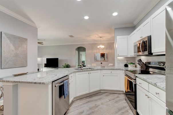 Chandelier, Interior, Kitchen, Pendant Lights, Recessed Lighting, Stainless Steel Appliances, Wood Texture Flooring