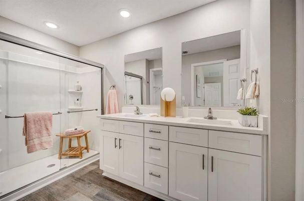 Bathroom, Dual Sink Vanities, Glass Shower, Interior, Recessed Lighting, Wood Texture Flooring